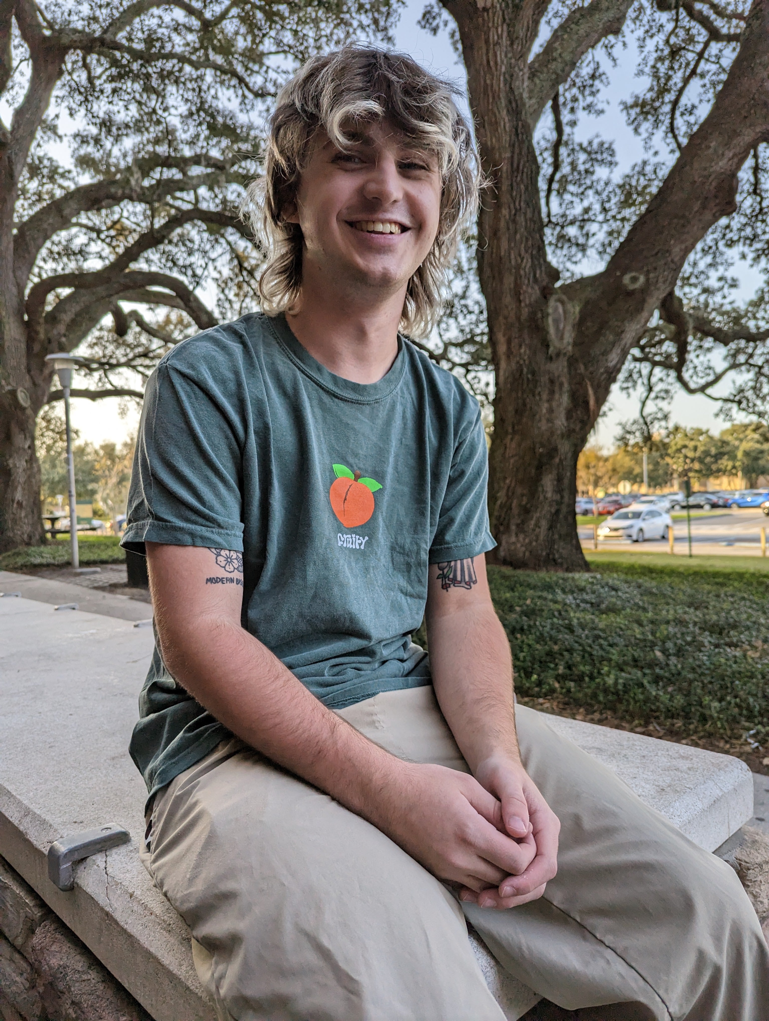 Peach Fruity Shirt Outside Sit Smile Dark Green T-Shirt Subtle Gay Pride Queer Fashion LGBTQ Clothing Inclusive Apparel
