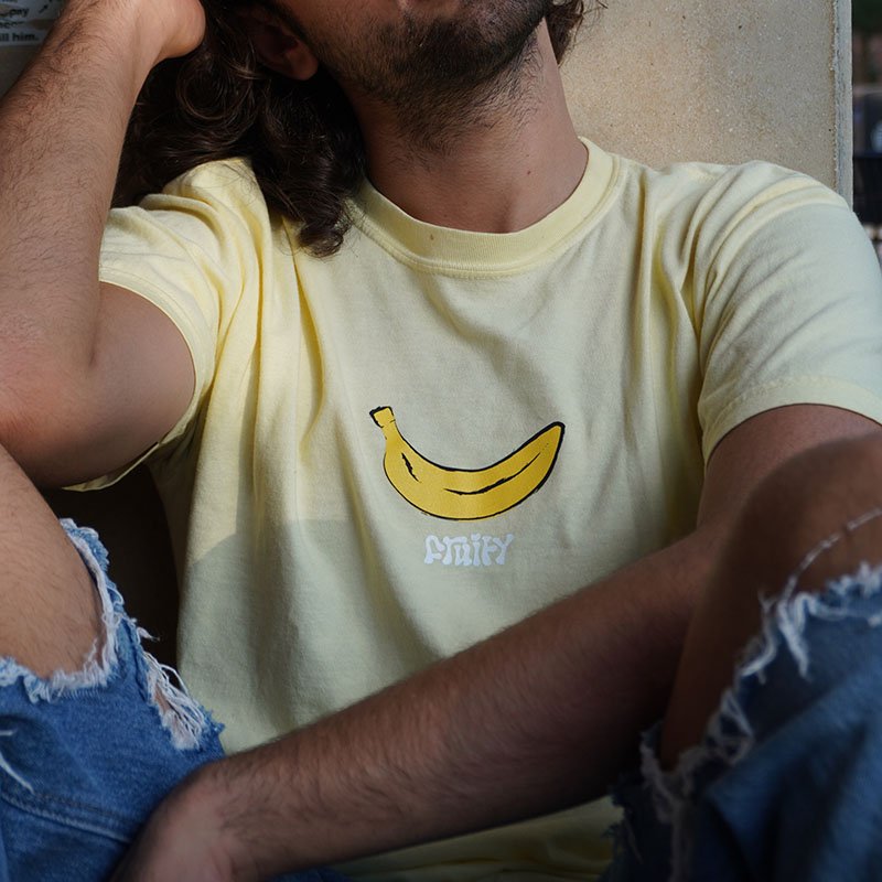 Banana Fruity Shirt Sit Against Wall Yellow T-Shirt Subtle Gay Pride Queer Fashion LGBTQ Clothing Inclusive Apparel