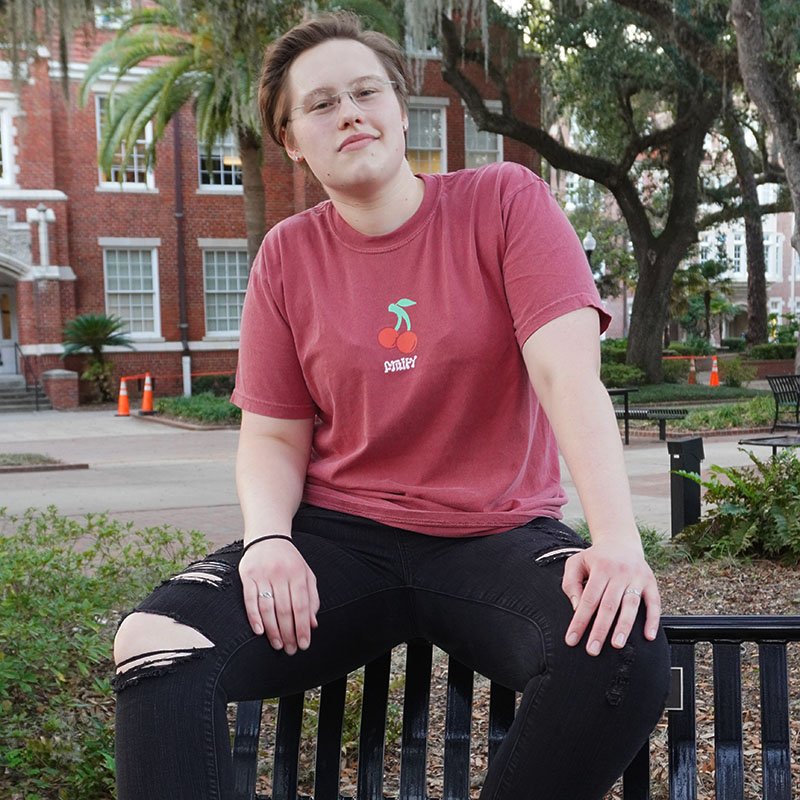 Cherry Fruity Shirt Sit Bench UMD Campus Crimson T-Shirt Subtle Gay Pride Queer Fashion LGBTQ Clothing Inclusive Apparel